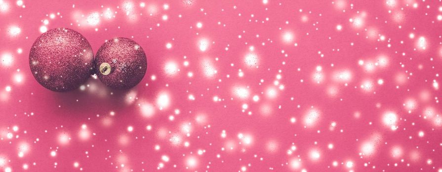 Gift decor, New Years Eve and happy celebration concept - Christmas baubles on pink background with snow glitter, luxury winter holiday card