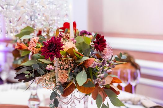 Rustic wedding decoration for festive table with beautiful flower composition. Autumn wedding