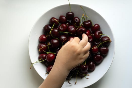 Healthy eating and food concept - cherries in white bowl. . High quality photo
