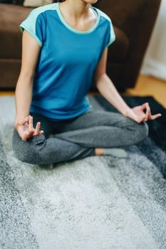 stress relief, muscle relaxation, breathing exercises, exercise, meditation, portrait of Young Asian woman relaxing her body from office work by practicing yoga by watching online tutorials.