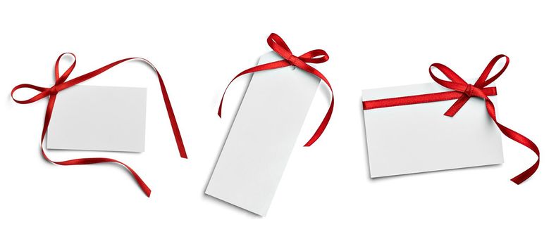 close up of a note card with ribbon bow on white background