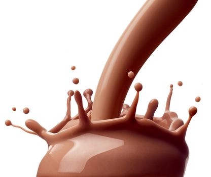 close up of a chocolate milk splash on white background