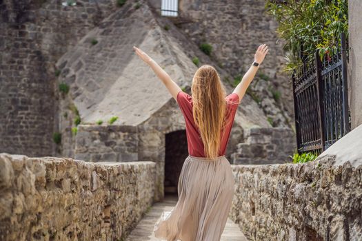 Woman tourist in Herceg Novi old town. Historical and touristic center of Herceg Novi. Montenegro.