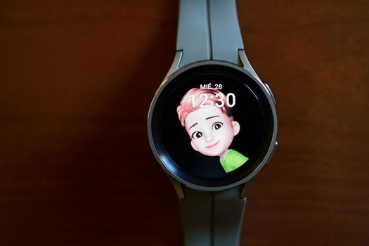 Granada, Andalusia, Spain - September 28th, 2022: New Samsung Watch 5 Pro with watch face of AR Emoji