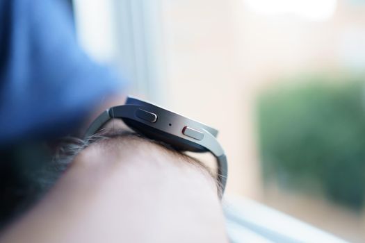 Granada, Andalusia, Spain - September 28th, 2022: New Samsung Watch 5 Pro on a man's arm. Detail of the buttons.