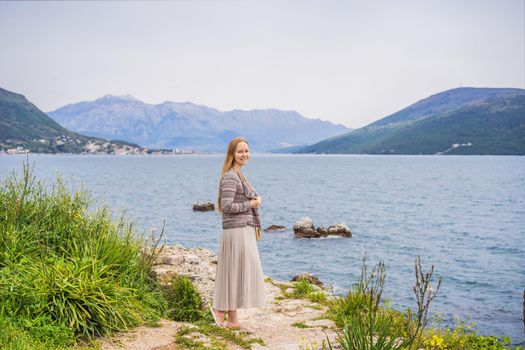 Woman tourist in Herceg Novi old town. Historical and touristic center of Herceg Novi. Montenegro.