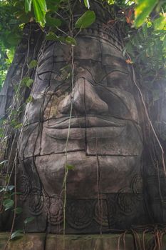 Randers, Denmark, March 2022: Decorative ancient statue in the jungle in Randers Tropical Zoo