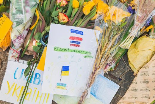 Copenhagen, Denmark, March 2022: Children's drawings and flowers near the Ukrainian embassy in Denmark.