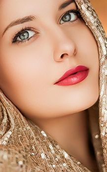 Beauty, luxury fashion and glamour, woman dressed in gold, portrait