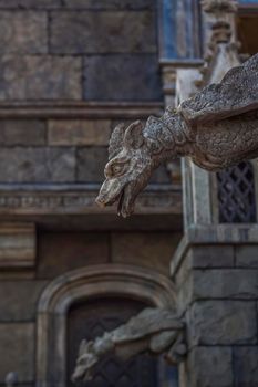 Antiquity in detail. Decoration of houses, balconies, windows, sculptures, walls. Elements of architectural design of buildings. Old plaster, Stone decorations. Elements of Gothic architecture.