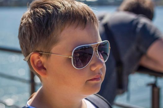 Portrait of a young man in sunglasses. Glasses, accessories