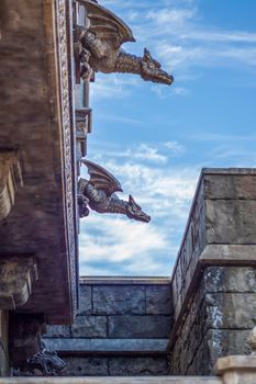 Antiquity in detail. Decoration of houses, balconies, windows, sculptures, walls. Elements of architectural design of buildings. Old plaster, Stone decorations. Elements of Gothic architecture.