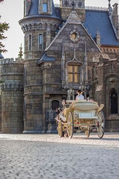 2022-08-16 Russia, Samara, Garibaldi Castle Tourist Center in the village of Khryashchevka, Samara region. The rider drives the carriage around the Castle.