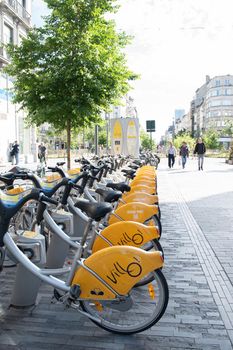 BRUSSELS,BELGIUM - June 02, 2022: public Villo bicycles parked in the sharing, High quality photo