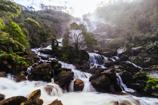 The iconic and popular St Columba Falls which is one of the highest waterfalls in Tasmania on a warm spring day in Pyengana, Tasmania, Australia