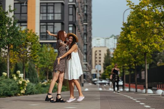 Meeting of two friends hugging in the street