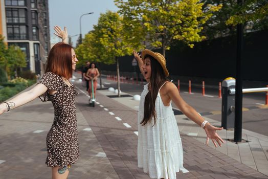 Meeting of two friends hugging in the street