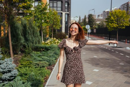 Fashion woman portrait of young pretty trendy girl posing at the city in Europe