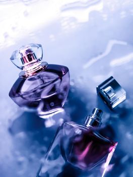 Perfumery, cosmetics and branding concept - Perfume bottle under purple water, fresh sea coastal scent as glamour fragrance and eau de parfum product as holiday gift, luxury beauty spa brand present