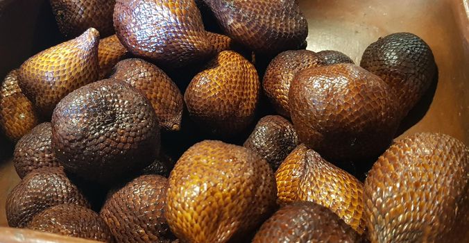 group of snake fruit or called salak in local indonesian language is a type of palm fruit commonly eaten also known as sala, the scientific name is Salacca zalacca.