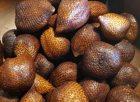group of snake fruit or called salak in local indonesian language is a type of palm fruit commonly eaten also known as sala, the scientific name is Salacca zalacca.