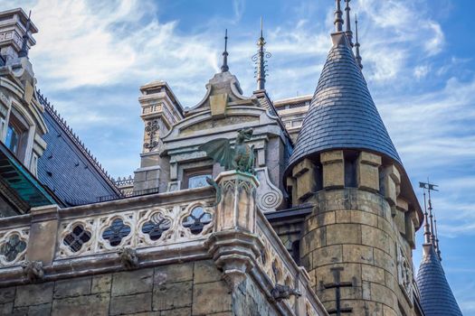 Antiquity in detail. Decoration of houses, balconies, windows, sculptures, walls. Elements of architectural design of buildings. Old plaster, Stone decorations. Elements of Gothic architecture.