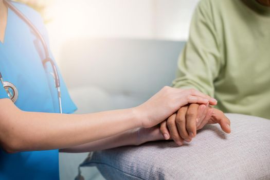 Closeup hand. Young woman helping hold hands offering her senior man, Caring nurse helping elderly old man care gets help from hospital, medical health care, International Day for the Elderly concept