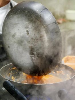 preparing autumn mushroom sauce for tagliatelle pasta- italian food