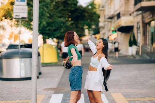 Meeting of two friends hugging in the street