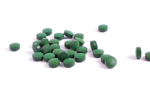 Vitamins antioxidants green. Spirulina Chlorella natural green superfood. dietary supplements. Pills isolated on white background. seaweed medicines. High quality photo