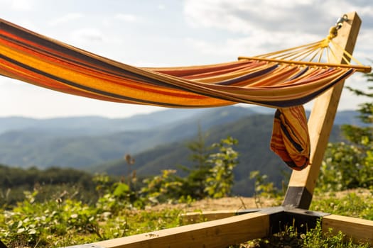 Empty hammok hanging in the mountains in summer.