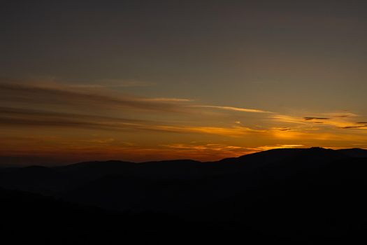 Sunset in mountains in summer landscape.