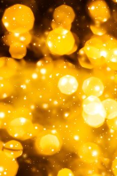 Golden Christmas lights, New Years Eve fireworks and abstract texture concept - Glamorous gold shiny glow and glitter, luxury holiday background