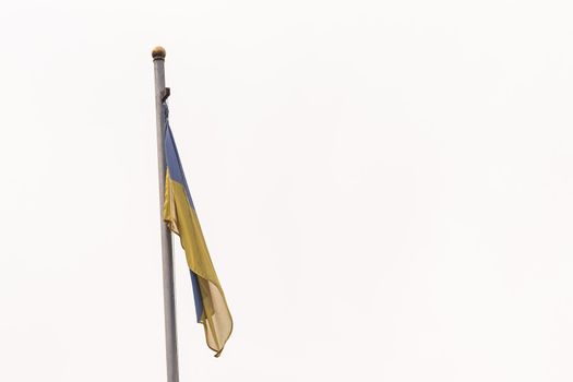 Ukrainian flag against the blue sky.