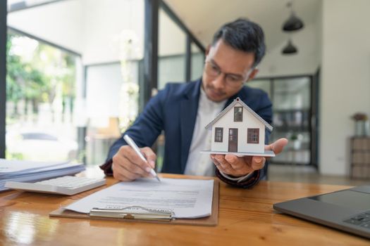 Real estate contract signing concept. Businesswoman signing a contract to legally for the purchase, mortgage and rental of real estate