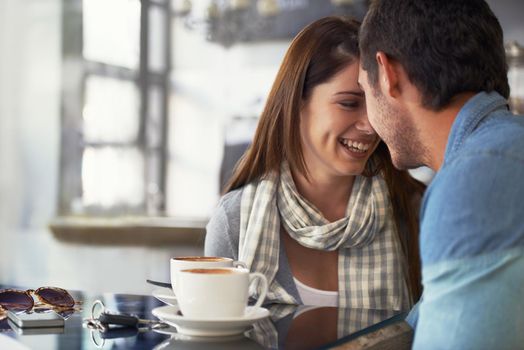 Her smile is permanent when shes with him. A loving young couple at a coffee shop together