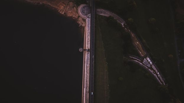 Aerial view from road between lake and land . High quality photo