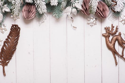 Christmas flat lay composition from pine, cones, balls on wooden background top view. Copy space.