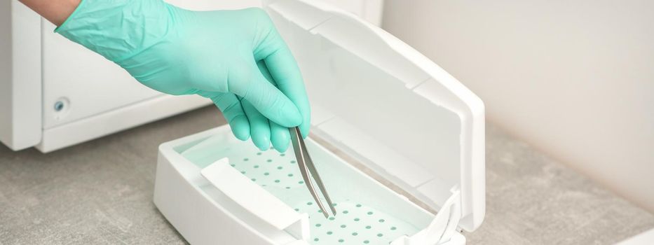 Hand disinfects tweezers with cleaning systems for medical instruments. Ultrasonic cleaner