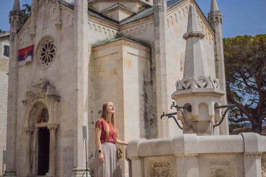 Woman tourist in Herceg Novi old town. Historical and touristic center of Herceg Novi. Montenegro.