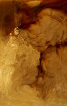 Close up of coffee and milk mixing in a glass cup background