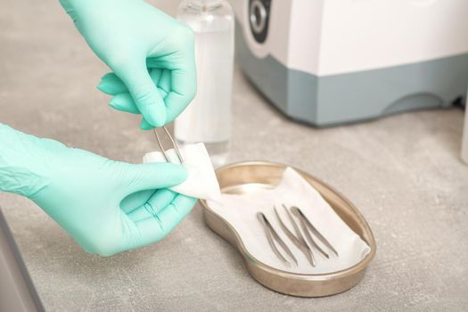 Hand disinfects tweezers with cleaning systems for medical instruments. Ultrasonic cleaner