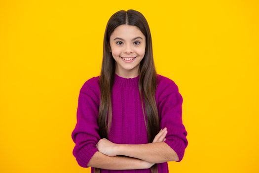 Pretty teen girl headshot portrait. Adorable little girl child isolated on a yellow background