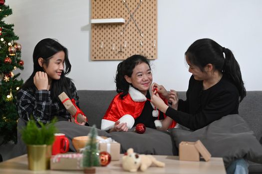 Group of young asian girls celebrating Christmas Eve at home.