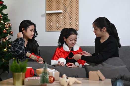Group of asian girls celebrating Christmas at home.