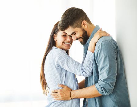 Portrait of a lovely young couple together at home