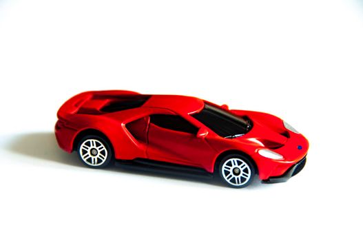 Kuala Lumpur, Malaysia - September 2022 : Selective focus of miniature toy car of Ford GT on white cover background. Copy space.