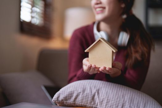 Young asian woman happy life sitting on couch cozy living room at home. The house was homely concept.