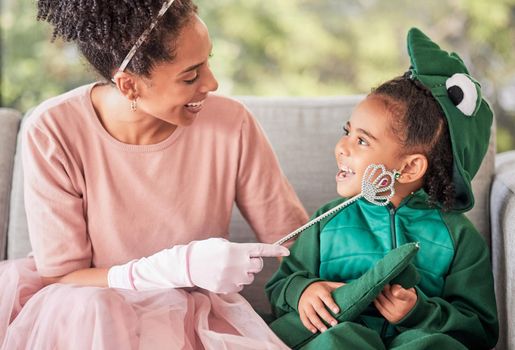 Fantasy, mother and child in halloween costume at home with girl in a dinosaur outfit and mom as a fairy princess. Smile, happy and young kid excited for a holiday celebration with a single parent.