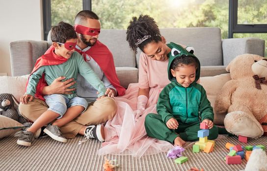 Happy family, superhero costume and toys in living room, kids playing and having fun together. Love, creative children outfit for halloween or fantasy game with caring dad, mom and children bonding